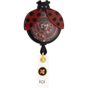 A black and red ladybug shaker badge with a heart design and a white tag featuring a logo.