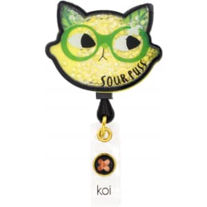 A quirky green and yellow shaker badge featuring a cat design with large glasses and a playful expression.