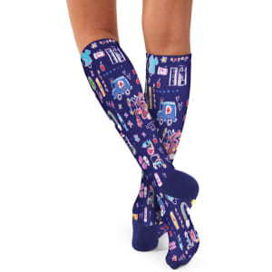 A pair of navy compression socks featuring a vibrant, multi-coloured pattern and a logo.