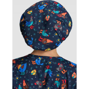 A bouffant scrub cap in navy featuring colourful animal patterns, including chickens and whimsical characters.
