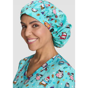A bouffant scrub cap in turquoise with a playful print of cartoon characters and festive elements.