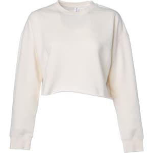 A women's crop crew in a light cream colour, featuring long sleeves and a relaxed fit. It has a logo on the garment.