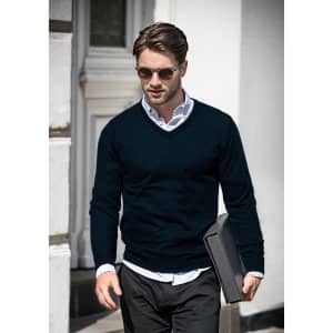 A navy V-neck jumper paired with a white shirt and sunglasses, held by a man carrying a folder.