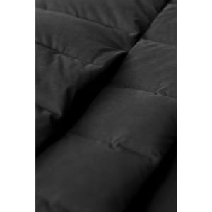 A close-up of a black down jacket featuring a quilted design with visible stitching and padded sections.