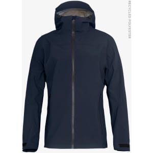 A navy blue women's shell jacket with a hood and zip closure, featuring a logo on the chest.