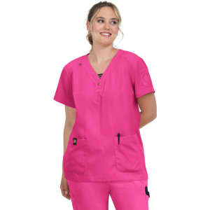 A pink scrub top with short sleeves, featuring two front pockets and a V-neckline, worn by a smiling model.