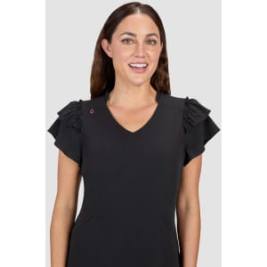 A black dress featuring ruffled sleeves and a V-neckline, displayed by a smiling woman. The dress has a logo on one shoulder.