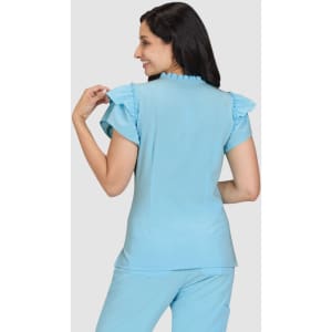 A top in light blue with ruffle details on the sleeves, worn by a model from the back.