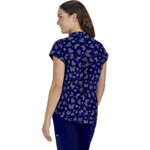 Ari Top (Print) in navy featuring a whimsical butterfly and heart pattern, displaying a woman from the back.