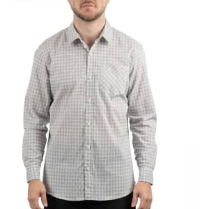 A man wearing a fitted, check-patterned shirt in shades of grey and white, featuring a button-up front and a single pocket.
