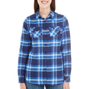 A long sleeve yarn-dyed flannel shirt in blue and navy featuring a check pattern and two chest pockets.