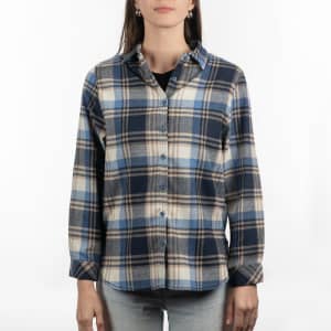 A plaid flannel shirt in shades of navy, cream, and light blue with long sleeves and a button-up front.