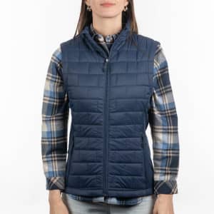 A quilted puffer vest in navy, worn over a checked shirt, featuring a front zipper and pockets.