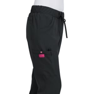 A pair of black pants with an elastic waistband and pockets, featuring a pink logo.