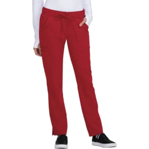 A pair of red pants with a drawstring waistband and side pockets, worn by a model. The product has a logo.