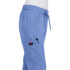 A pair of light blue pants with an elastic waistband and pockets, featuring a logo on the pocket.