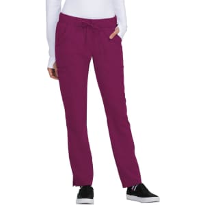 A pair of Buttercup Pant in a vibrant burgundy colour, featuring pockets and a drawstring waistband.