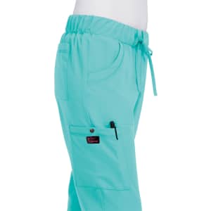 A pair of turquoise pants with an elastic waistband and a side pocket, featuring a logo on the leg.