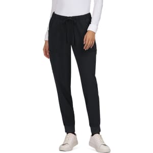 A pair of black Aster Pants with a drawstring waist, featuring side pockets and elastic cuffs.