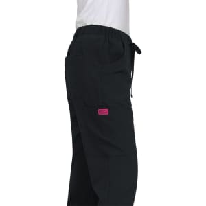 A pair of black Aster Pants featuring pockets and an elastic waist, with a pink branding label.