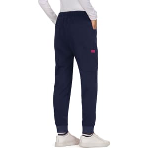 Navy pants with an elastic waistband and pockets, featuring a small coloured logo. Casual silhouette with tapered legs.
