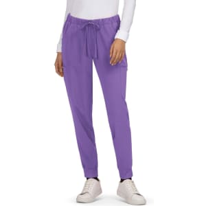 A pair of purple Aster Pants with a drawstring waist and side pockets, worn with white sneakers.