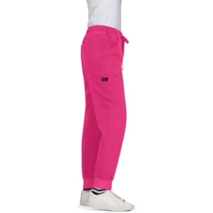 A pair of pink cargo pants with a drawstring waist and cuffed ankles, featuring a logo.