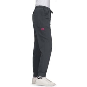 A pair of grey Aster Pants featuring pockets and a logo, styled with a drawstring waist and cuffs.