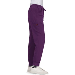 A pair of purple Aster Pants featuring pockets and an elastic waistband, displayed on a model side view.