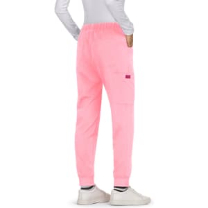 Pink pants with an elastic waistband and cargo pockets, featuring a branding logo.