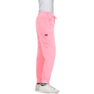 A pair of bright pink Aster Pants with a relaxed fit and elastic cuffs, featuring a logo.