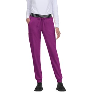 A pair of vibrant pink joggers with a black and white striped waistband, featuring side pockets.