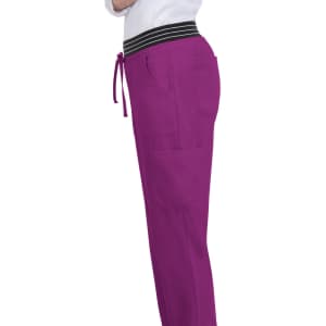 A pair of hollyhock jogger pants in vibrant purple with a black striped waistband and multiple pockets.