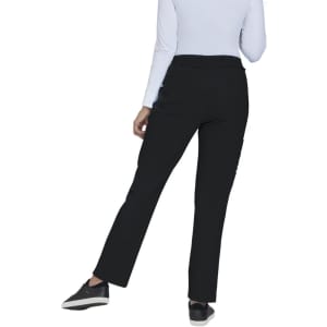 A pair of black pants from the back, featuring a straight leg design and worn with a light-coloured top and black shoes.