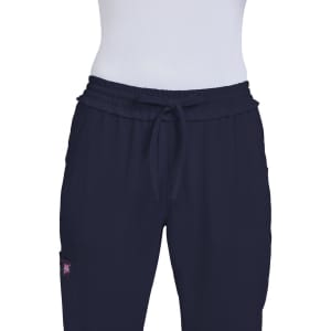 Navy blue pants with an elastic waistband and a logo on the side. Suitable for casual wear.
