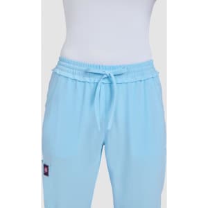 Light blue pants with a relaxed fit and drawstring waistband, featuring a logo on one side.
