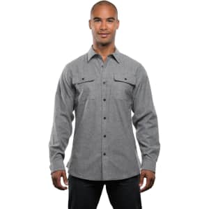 A grey men's long-sleeve solid flannel button-up shirt displayed from the side, featuring a pocket and a logo.