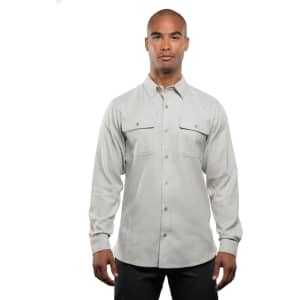 A light grey long sleeve yarn-dyed flannel shirt with button-up front and two chest pockets. It features a logo.