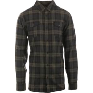 A short sleeve, yarn-dyed flannel shirt featuring a black and grey plaid pattern, with two front pockets and a logo.