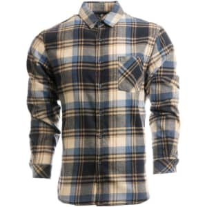 A button-up shirt in a blue, cream, and navy plaid pattern, featuring a chest pocket and a logo.