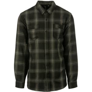 A flannel shirt featuring a black and grey plaid pattern with two chest pockets and long sleeves.
