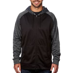 A man is wearing a black full zip performance raglan hoodie with grey sleeves and a front pocket. The hoodie has a logo.
