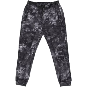 Tech Fleece Knit Jogger Pants in a black and grey tie-dye pattern, featuring an elastic waistband and side pockets.
