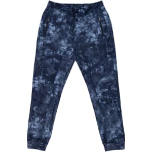 Tech Fleece Knit Jogger Pants in a navy tie-dye pattern with zippered pockets and a logo.