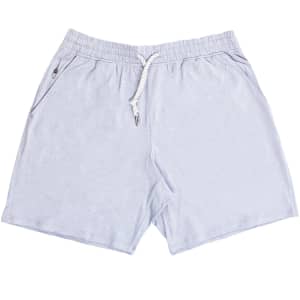 Soft jersey shorts in light blue, featuring an elastic waistband and side pockets. Includes a branding logo.