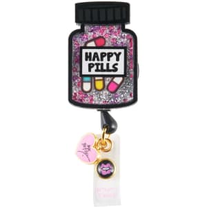 A retractable badge holder shaped like a pill bottle, featuring pink glitter and various embellishments.