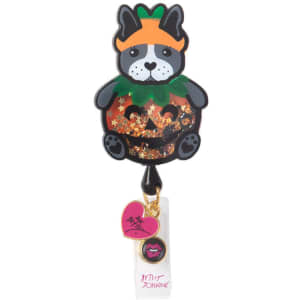 A cute retractable badge featuring a dog in a pumpkin costume with glitter and a logo at the bottom.