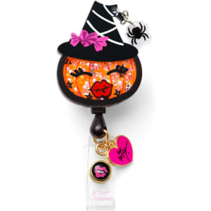 A retractable badge reel featuring a pumpkin design with a witch's hat, decorated in orange and black.