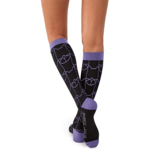 A pair of black compression socks with a purple pattern, featuring a logo on the side.