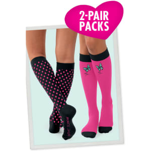 Two pairs of compression socks: one with black polka dots and one in pink featuring butterfly designs. Each has a logo.